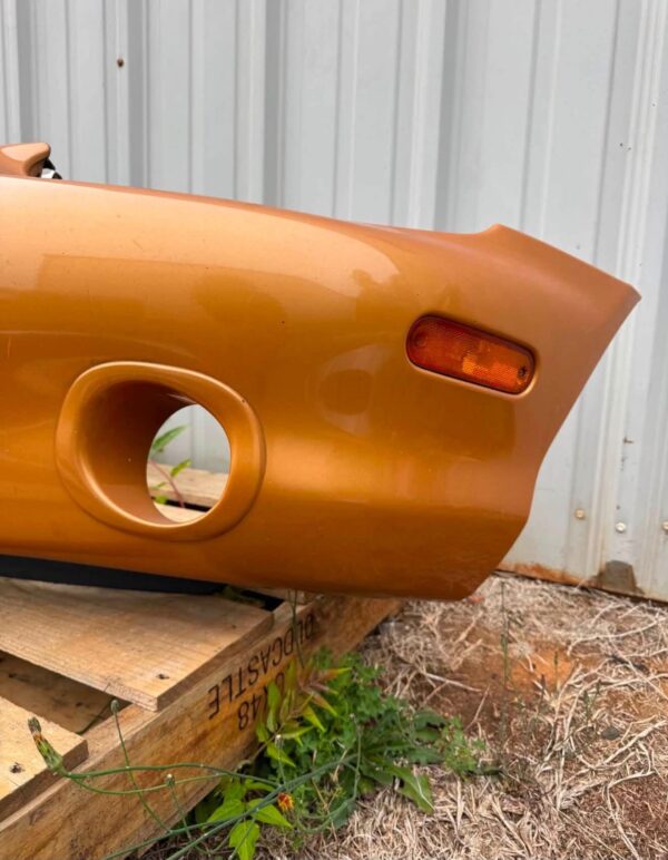 OEM factory front bumper cover for a 1999–2000 Mazda MX-5 Miata (NB generation)