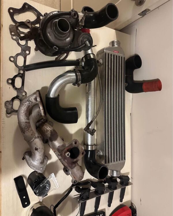 Custom 1.6L NA Mazda Miata Turbo Charger Upgrade Kit featuring a BEGi / Cartech hardware combination.