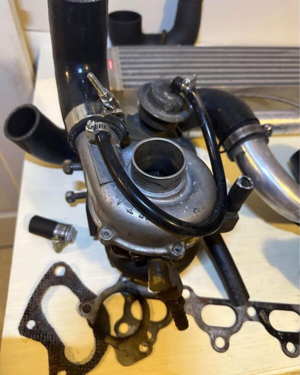 Custom 1.6L NA Mazda Miata Turbo Charger Upgrade Kit featuring a BEGi / Cartech hardware combination.
