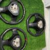 Custom Carbon Fiber Flat-Bottom Steering Wheels for Mazda Vehicles (such as the RX-7 FD and Miata NB).
