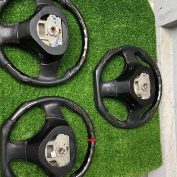 Custom Carbon Fiber Flat-Bottom Steering Wheels for Mazda Vehicles (such as the RX-7 FD and Miata NB).