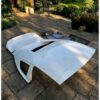 Removable fiberglass fastback roof conversion kit designed for standard convertible sports cars