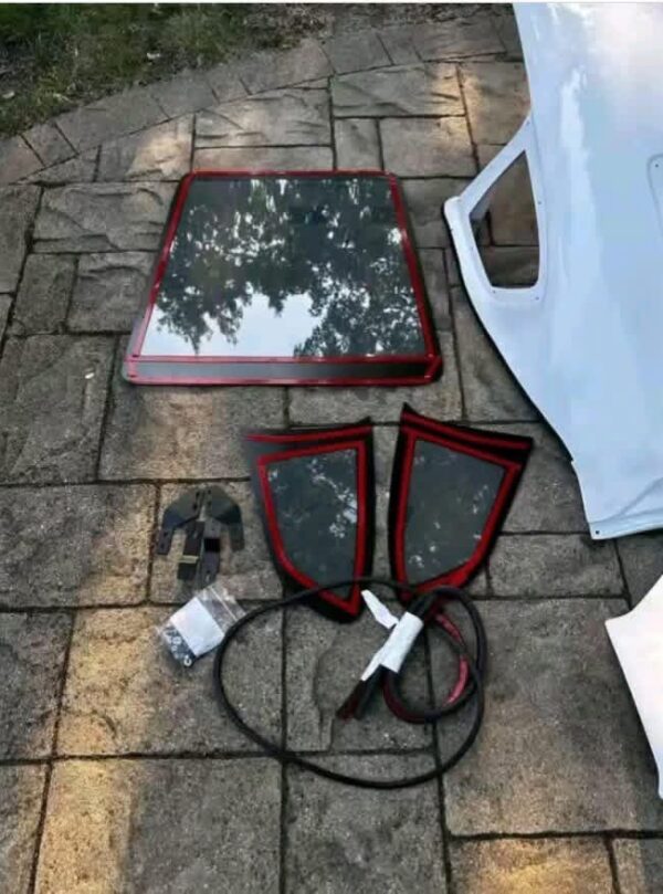 Removable fiberglass fastback roof conversion kit designed for standard convertible sports cars
