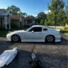 Removable fiberglass fastback roof conversion kit designed for standard convertible sports cars