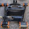 Aftermarket tubular adjustable front lower control arms featuring polyurethane bushings.
