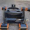 Aftermarket tubular adjustable front lower control arms featuring polyurethane bushings.