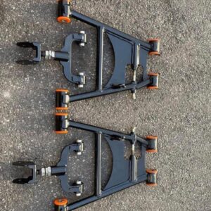 Aftermarket tubular adjustable front lower control arms featuring polyurethane bushings.
