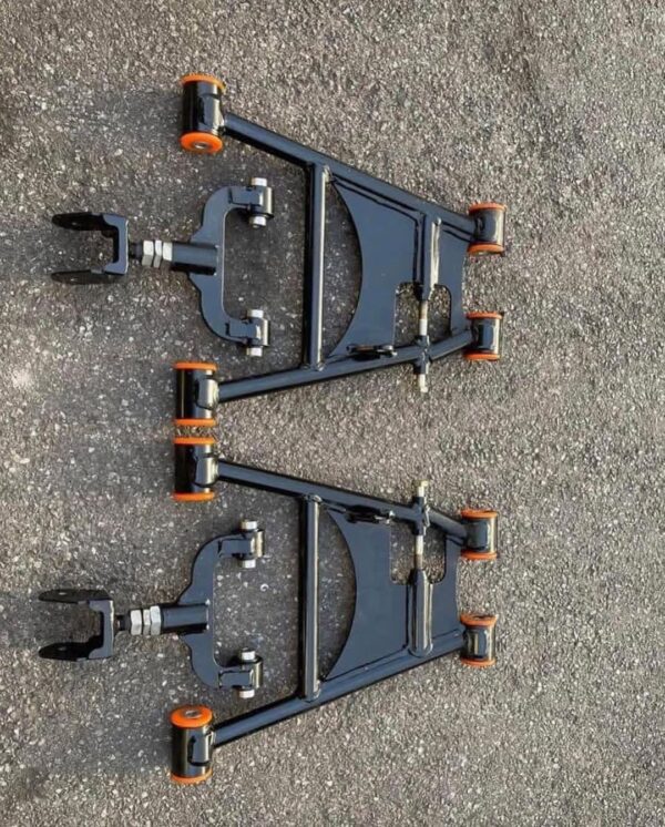 Aftermarket tubular adjustable front lower control arms featuring polyurethane bushings.