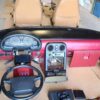 1993 Mazda MX-5 Miata Limited Edition (93LE) Red Interior Conversion Kit laid out on cardboard for a restoration or component sale