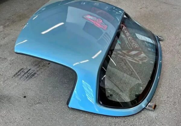 Crystal Blue OEM Hardtop for a Mazda MX-5 Miata (NA/NB generation).