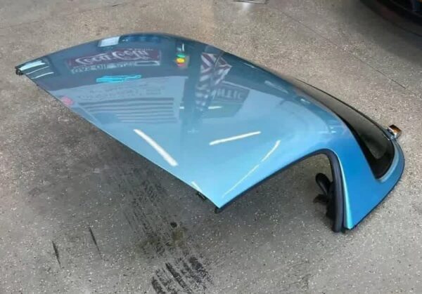 Crystal Blue OEM Hardtop for a Mazda MX-5 Miata (NA/NB generation).