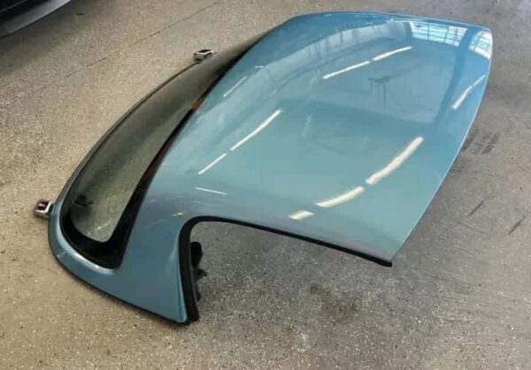 Crystal Blue OEM Hardtop for a Mazda MX-5 Miata (NA/NB generation).