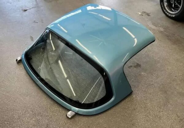 Crystal Blue OEM Hardtop for a Mazda MX-5 Miata (NA/NB generation).