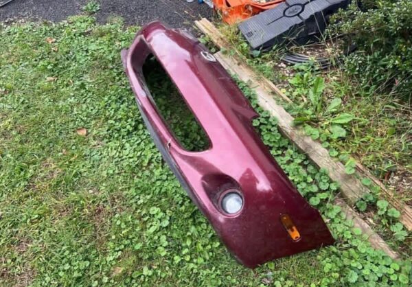 IMG_8532 OEM Factory Front Bumper Cover for a Mazda MX-5 Miata NB (specifically the facelifted Mk2.5 / NBFL model spanning 2001–2005)