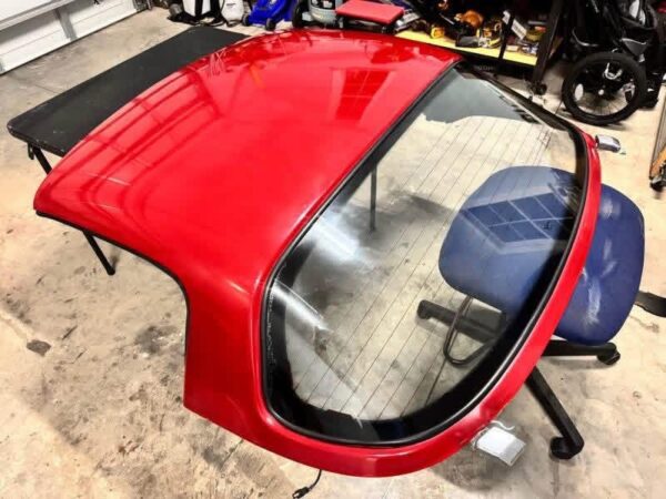 Mazda MX-5 Miata OEM removable hardtop finished in Classic Red.