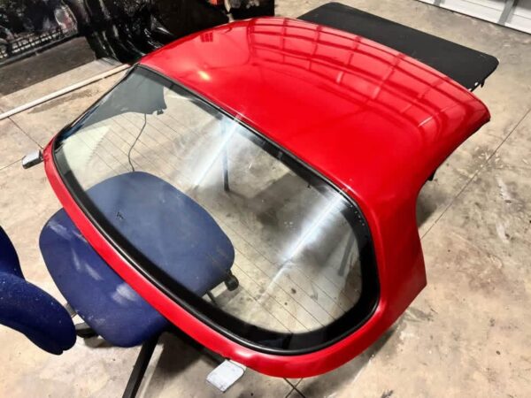 Mazda MX-5 Miata OEM removable hardtop finished in Classic Red.