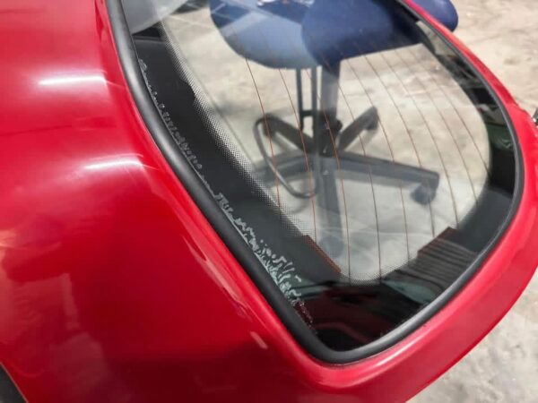 Mazda MX-5 Miata OEM removable hardtop finished in Classic Red.