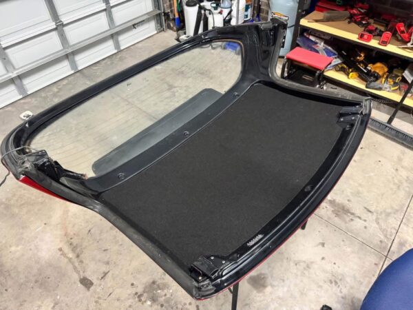 Mazda MX-5 Miata OEM removable hardtop finished in Classic Red.