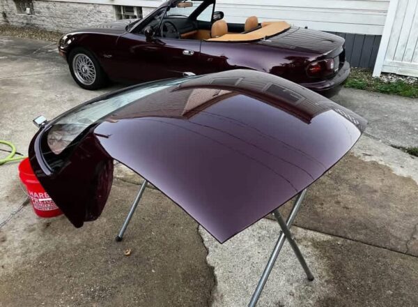 Mazda MX-5 Miata OEM removable hardtop finished in a factory Merlot / Mahogany Mica paint.