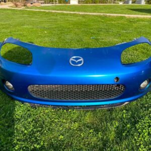 IMG_1481 OEM Mazda MX-5 Miata (NB2 / 2001–2005) Front Bumper Cover Assembly in Laser Blue / OEM Blue, complete with fog lights, center grille mesh, emblem, and lower lip.