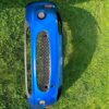 OEM Mazda MX-5 Miata (NB2 / 2001–2005) Front Bumper Cover Assembly in Laser Blue / OEM Blue, complete with fog lights, center grille mesh, emblem, and lower lip.