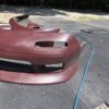 Screenshot 4-piece Full Aero Body Kit (Front Bumper, Rear Bumper, and Pair of Side Skirts) for the 1990–1997 Mazda MX-5 Miata (NA Generation), finished in dark burgundy/merlot paint.