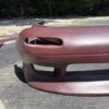 Screenshot 4-piece Full Aero Body Kit (Front Bumper, Rear Bumper, and Pair of Side Skirts) for the 1990–1997 Mazda MX-5 Miata (NA Generation), finished in dark burgundy/merlot paint.