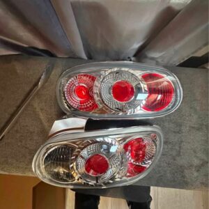 IMG_1795 Pair of OEM Mazda MX-5 Miata (NB generation, specifically NB2 / 2001–2005) Clear Tail Lights / Taillights (often referred to as Altezza-style or factory clear-lens rear combination lamps).