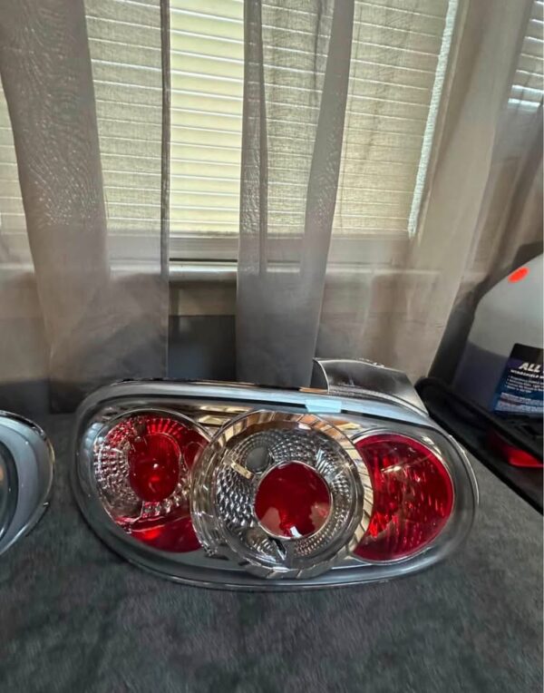 Pair of OEM Mazda MX-5 Miata (NB generation, specifically NB2 / 2001–2005) Clear Tail Lights / Taillights (often referred to as Altezza-style or factory clear-lens rear combination lamps).