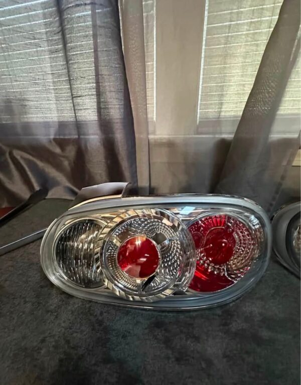 Pair of OEM Mazda MX-5 Miata (NB generation, specifically NB2 / 2001–2005) Clear Tail Lights / Taillights (often referred to as Altezza-style or factory clear-lens rear combination lamps).